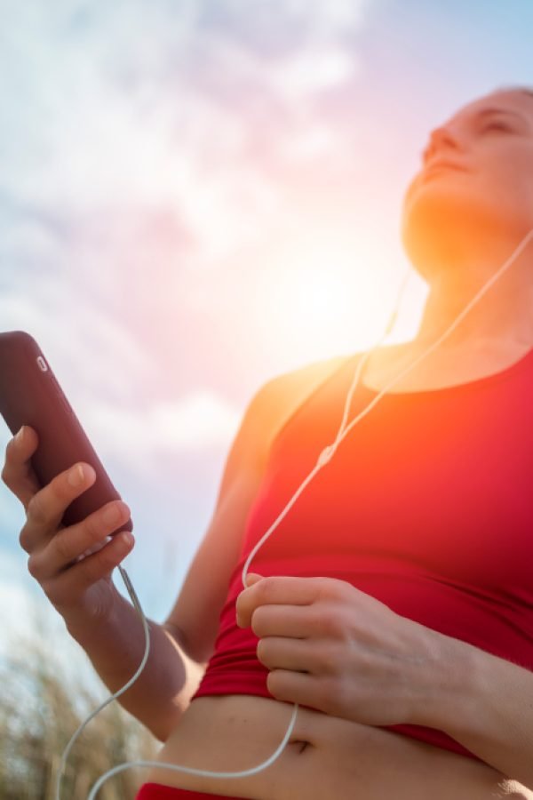 woman runner with MP3 player, smartphone, listening to music